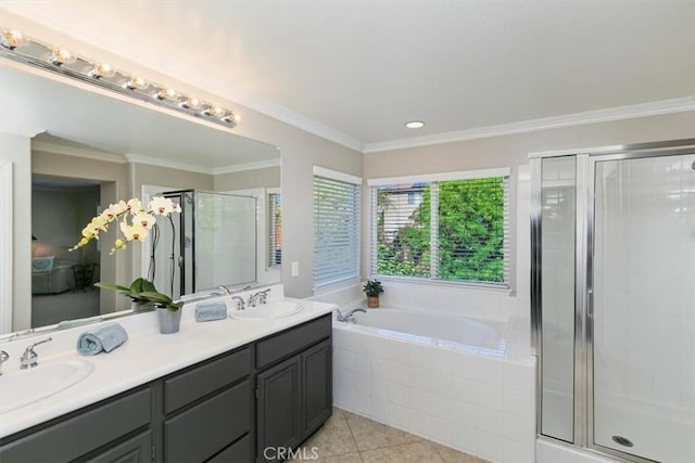 bathroom with a stall shower, tile patterned floors, a garden tub, double vanity, and crown molding