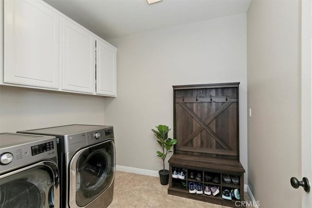 laundry room with washing machine and clothes dryer, cabinet space, baseboards, and carpet floors
