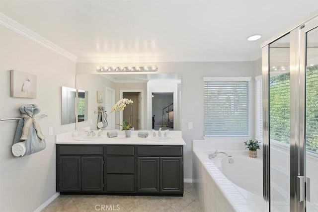 full bathroom featuring double vanity, ornamental molding, a bath, and tile patterned flooring