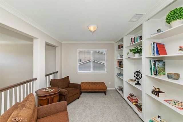 living area featuring crown molding, carpet flooring, and baseboards