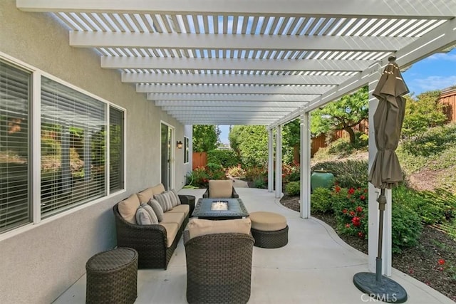 view of patio / terrace with fence, an outdoor living space with a fire pit, and a pergola