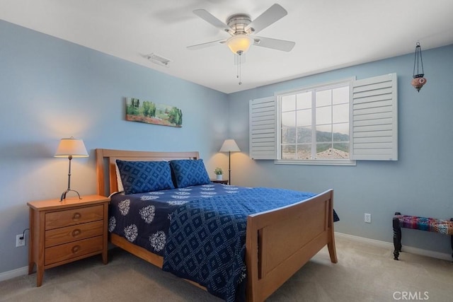 bedroom featuring carpet, baseboards, and a ceiling fan