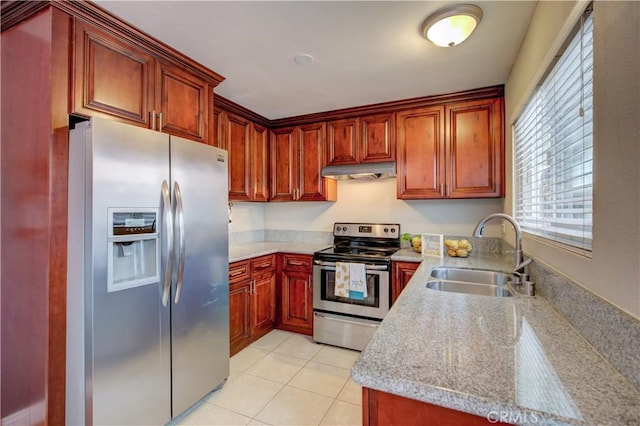 2844 E 3rd St Unit 207, Long Beach, CA 90814 - kitchen with appliances with stainless steel finishes, a sink, under cabinet range hood, light countertops, and light tile patterned flooring