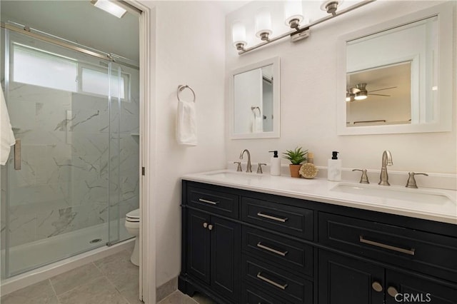 20 Parkhurst St, Chico, CA 95928 - bathroom featuring toilet, a marble finish shower, double vanity, and ceiling fan