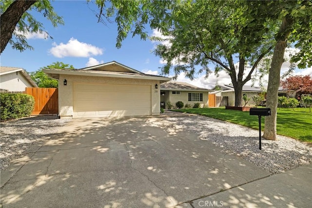 20 Parkhurst St, Chico, CA 95928 - single story home with driveway, stucco siding, and a garage