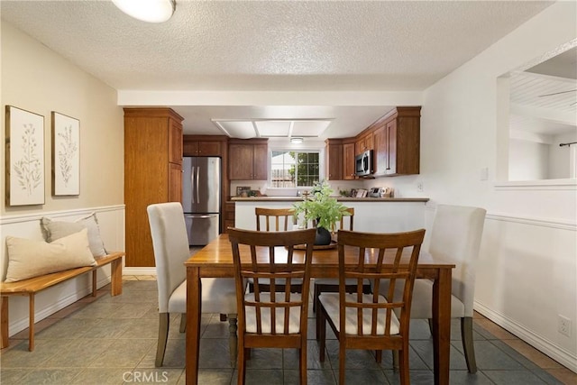 20 Parkhurst St, Chico, CA 95928 - dining room with light tile patterned floors and a textured ceiling
