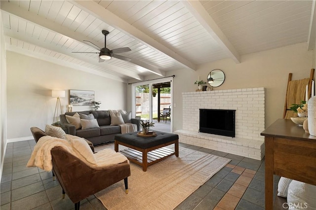 20 Parkhurst St, Chico, CA 95928 - living room with ceiling fan, beam ceiling, a fireplace, and tile patterned flooring