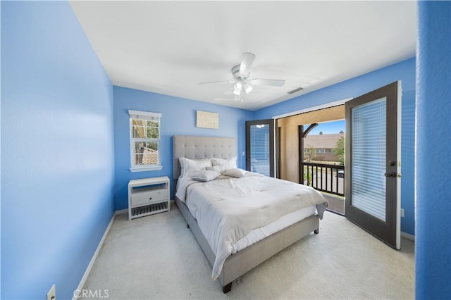 bedroom featuring baseboards, heating unit, access to exterior, carpet flooring, and a ceiling fan