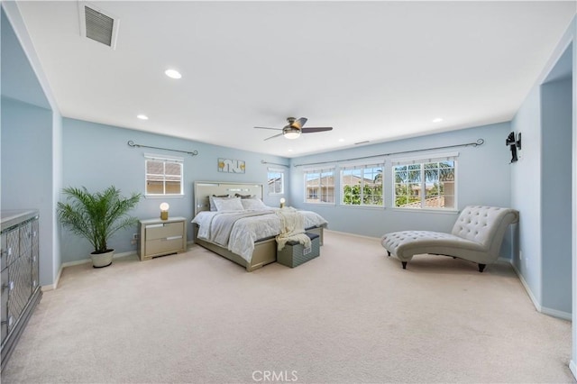 bedroom featuring light carpet, recessed lighting, baseboards, and ceiling fan