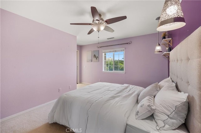 bedroom featuring carpet, baseboards, and a ceiling fan