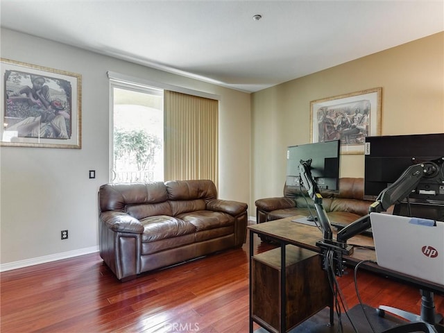 home office with wood finished floors and baseboards