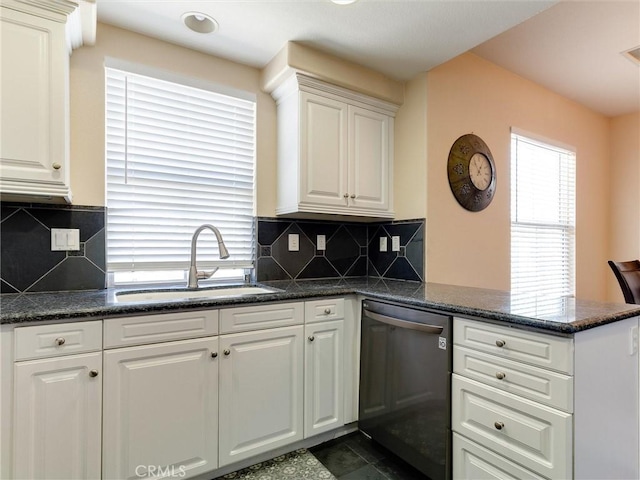 kitchen featuring dishwashing machine, a sink, a peninsula, and white cabinets