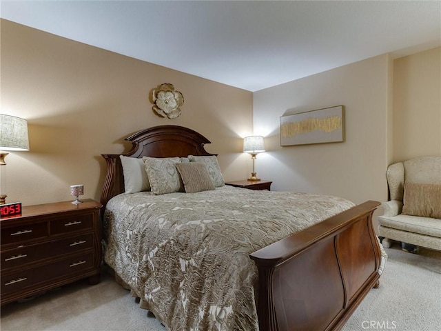 bedroom with light carpet