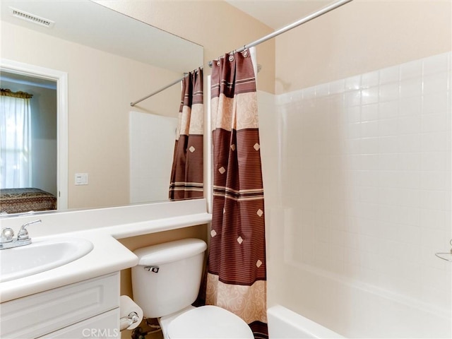 bathroom featuring vanity, toilet, and shower / tub combo