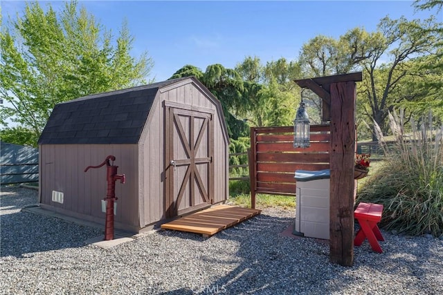 view of shed with fence