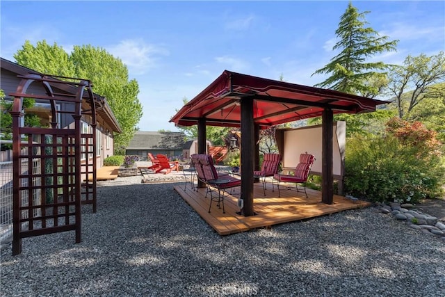view of play area featuring a gazebo and a deck