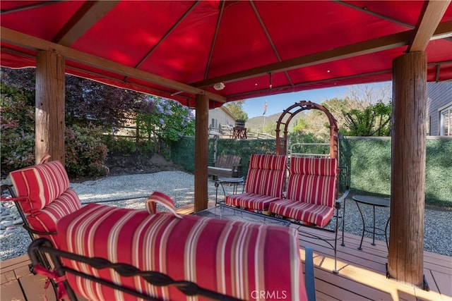 deck with a gazebo and fence