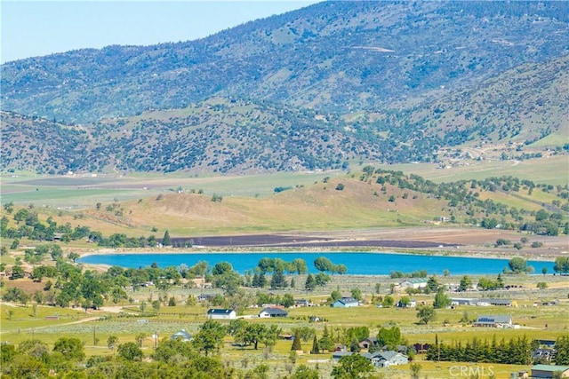drone / aerial view of a water and mountain view