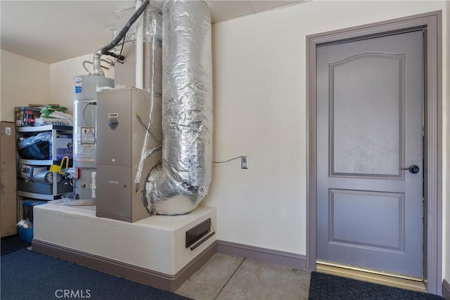 utility room with water heater