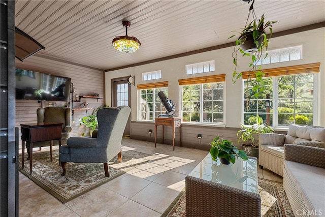 sunroom / solarium with plenty of natural light, tile patterned floors, wooden walls, and wooden ceiling