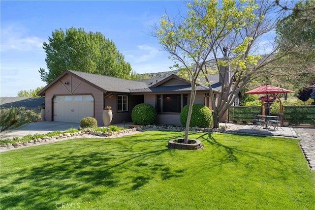 single story home featuring a garage and concrete driveway