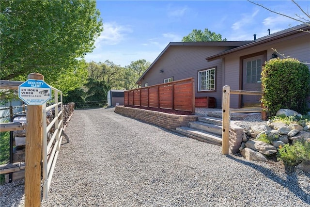 view of side of home with fence