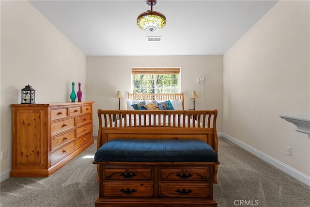 bedroom featuring carpet and baseboards