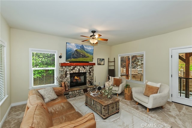 28589 Shenandoah Dr, Lake Arrowhead, CA 92352 - living room featuring healthy amount of natural light, ceiling fan, baseboards, and a stone fireplace