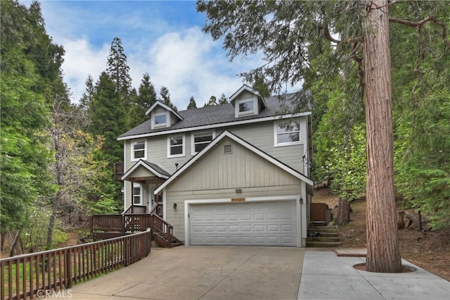 28589 Shenandoah Dr, Lake Arrowhead, CA 92352 - view of front of home featuring concrete driveway, roof with shingles, and stairs