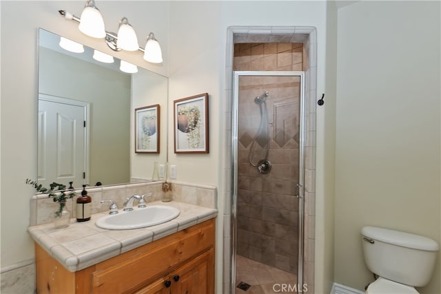 28589 Shenandoah Dr, Lake Arrowhead, CA 92352 - bathroom featuring a stall shower, vanity, and toilet