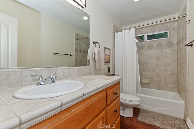 28589 Shenandoah Dr, Lake Arrowhead, CA 92352 - bathroom with wood finished floors, shower / tub combo, toilet, and vanity