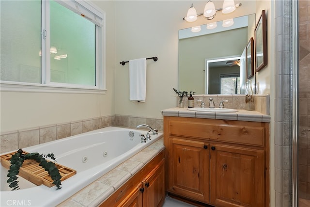 28589 Shenandoah Dr, Lake Arrowhead, CA 92352 - bathroom with a jetted tub, vanity, and ceiling fan