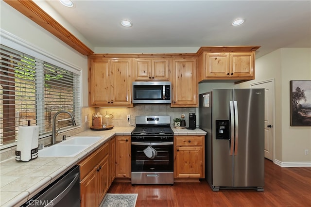 28589 Shenandoah Dr, Lake Arrowhead, CA 92352 - kitchen featuring stainless steel appliances, a sink, tile counters, dark wood-type flooring, and recessed lighting