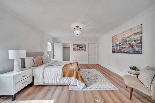 932 S Cloverdale Ave, Los Angeles, CA 90036 - bedroom featuring light wood-style floors, ornamental molding, and baseboards