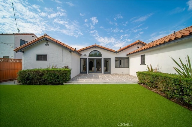 932 S Cloverdale Ave, Los Angeles, CA 90036 - back of property with stucco siding, french doors, a tile roof, and a patio