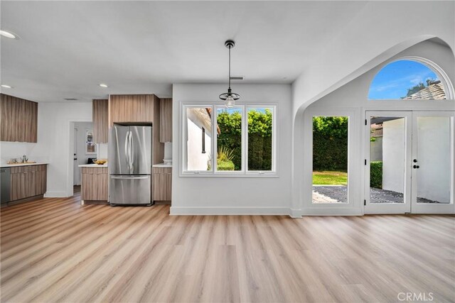 932 S Cloverdale Ave, Los Angeles, CA 90036 - kitchen featuring freestanding refrigerator, modern cabinets, light wood-style floors, light countertops, and recessed lighting