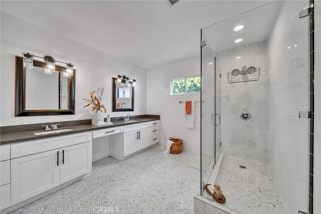 932 S Cloverdale Ave, Los Angeles, CA 90036 - bathroom with a marble finish shower, double vanity, and baseboards