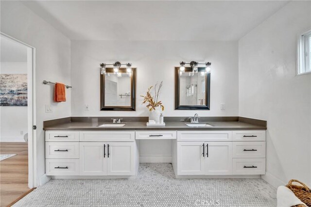 932 S Cloverdale Ave, Los Angeles, CA 90036 - full bathroom featuring double vanity and baseboards