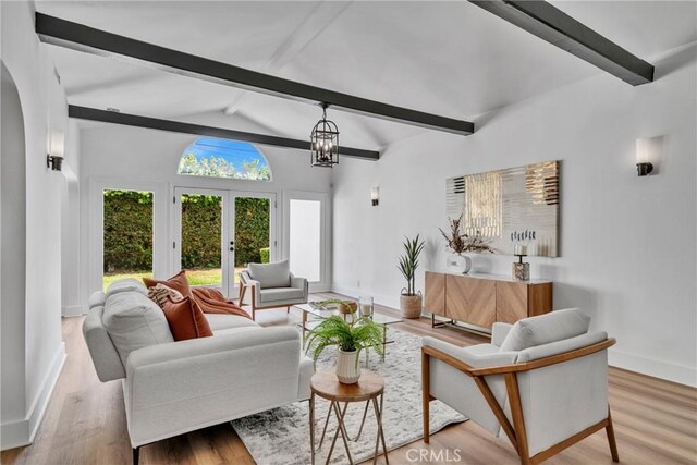 932 S Cloverdale Ave, Los Angeles, CA 90036 - living room with baseboards, french doors, and wood finished floors