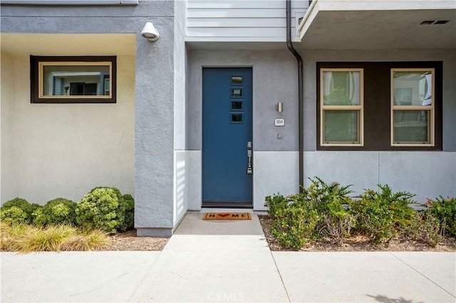 304 Placemark, Irvine, CA 92614 - doorway to property featuring stucco siding