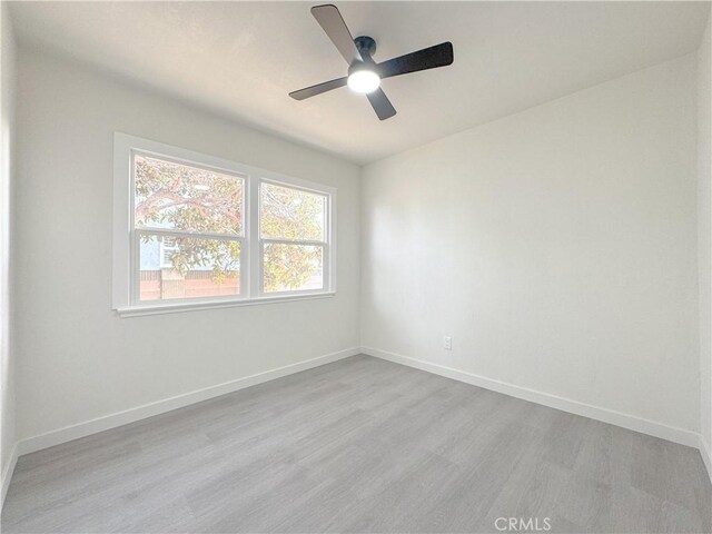 15811 S Tarrant Ave, Compton, CA 90220 - spare room with wood finished floors, ceiling fan, and baseboards