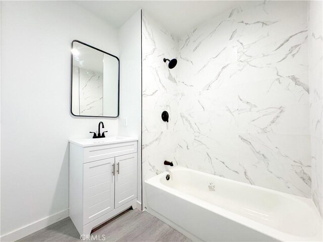 15811 S Tarrant Ave, Compton, CA 90220 - bathroom featuring vanity,  shower combination, and wood finished floors