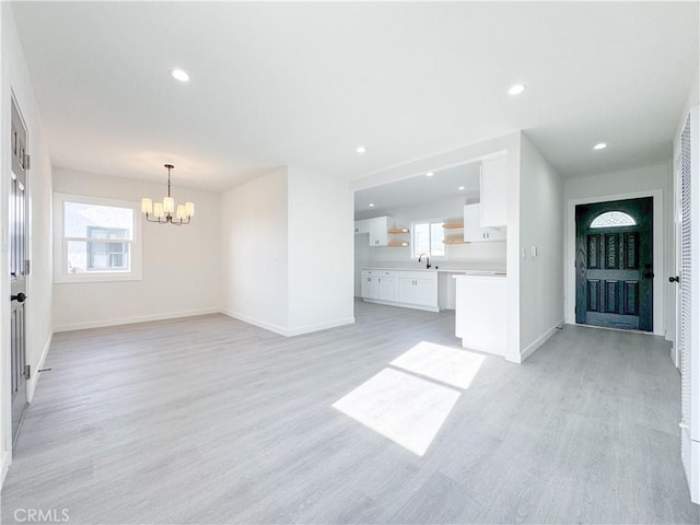 15811 S Tarrant Ave, Compton, CA 90220 - entryway with a chandelier, light wood-type flooring, baseboards, and recessed lighting