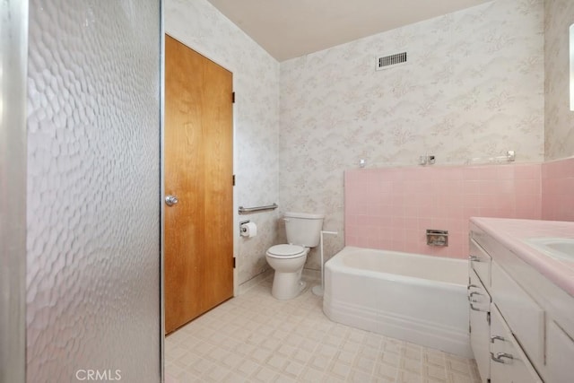 7861 Cora St, Sunland, CA 91040 - bathroom featuring wallpapered walls, toilet, a bath, and vanity