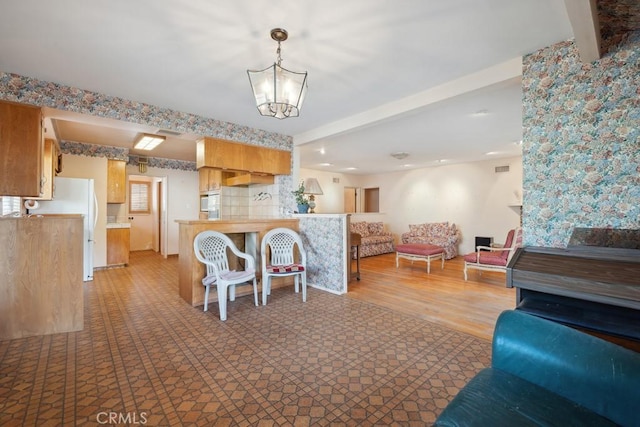 7861 Cora St, Sunland, CA 91040 - living room featuring a chandelier, beam ceiling, and recessed lighting