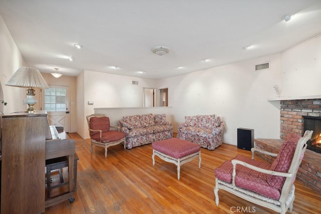 7861 Cora St, Sunland, CA 91040 - living room with wood finished floors and a fireplace