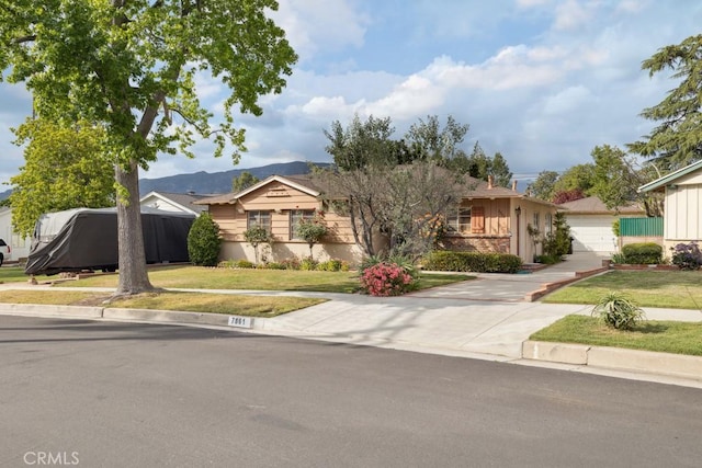 7861 Cora St, Sunland, CA 91040 - view of front facade with a front lawn, a garage, a mountain view, and concrete driveway