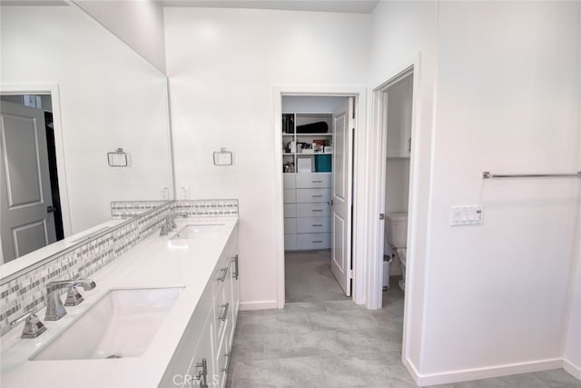 89 Baculo St, Rancho Mission Viejo, CA 92694 - bathroom with double vanity, decorative backsplash, and a walk in closet