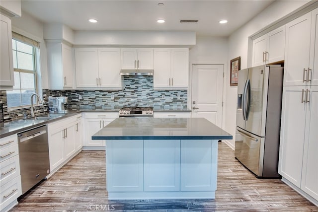 89 Baculo St, Rancho Mission Viejo, CA 92694 - kitchen featuring stainless steel appliances, a center island, tasteful backsplash, white cabinetry, and recessed lighting
