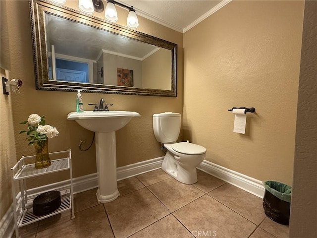 26490 Mapleridge Way, Moreno Valley, CA 92555 - bathroom with ornamental molding, tile patterned flooring, toilet, baseboards, and a textured wall